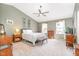 Serene main bedroom featuring a spacious layout, ceiling fan, and ample natural light at 311 Pate St, Apex, NC 27502