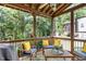 Relaxing screened porch with comfortable seating and a view of the backyard at 311 Pate St, Apex, NC 27502