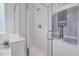 Modern bathroom with a glass-enclosed shower and sleek fixtures, enhanced by decorative towels at 316 Alice Trace Place, Angier, NC 27501