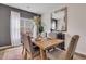 Cozy dining area with rustic wood table, elegant decor, and natural light at 316 Alice Trace Place, Angier, NC 27501