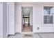 Welcoming front entrance with a Mungo Homes doormat and light-filled hallway at 316 Alice Trace Place, Angier, NC 27501