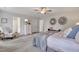 Serene main bedroom with stylish decor, including decorative mirrors and a comfortable seating area at 316 Alice Trace Place, Angier, NC 27501