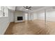 Finished basement with wood-look flooring, fireplace, and access to other rooms at 3204 Manor Ridge Dr, Raleigh, NC 27603