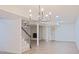 Spacious basement area with wood-look flooring, fireplace, and a chandelier at 3204 Manor Ridge Dr, Raleigh, NC 27603