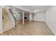 Finished basement showcasing the wood-look flooring and staircase at 3204 Manor Ridge Dr, Raleigh, NC 27603
