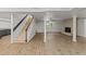 Spacious finished basement with wood-look flooring and a cozy fireplace at 3204 Manor Ridge Dr, Raleigh, NC 27603