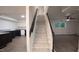 Finished basement stairs leading to a bright living space with a kitchenette and new flooring at 3204 Manor Ridge Dr, Raleigh, NC 27603
