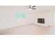 Finished basement featuring a brick fireplace, wood-look flooring, and ample natural light at 3204 Manor Ridge Dr, Raleigh, NC 27603