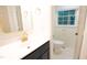 Bathroom with modern fixtures, sleek vanity, and natural light from the window at 3204 Manor Ridge Dr, Raleigh, NC 27603