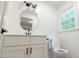 Well-lit bathroom with a contemporary vanity, framed mirror, and black hardware for a modern look at 3204 Manor Ridge Dr, Raleigh, NC 27603