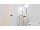 Bathroom with a vanity, modern hardware, framed mirror, toilet, and white walls at 3204 Manor Ridge Dr, Raleigh, NC 27603