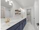 Bathroom features double sinks, quartz countertops, modern fixtures and ample storage at 3204 Manor Ridge Dr, Raleigh, NC 27603