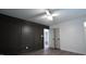Modern bedroom design featuring a decorative accent wall and a view of another room at 3204 Manor Ridge Dr, Raleigh, NC 27603