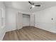 Bright bedroom featuring wood-look floors, neutral walls, and ceiling fan at 3204 Manor Ridge Dr, Raleigh, NC 27603