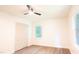 Bedroom featuring hardwood-style floors, a ceiling fan, a closet, and a bright window at 3204 Manor Ridge Dr, Raleigh, NC 27603