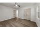 Bedroom featuring hardwood floors, ceiling fan, closet, and light-colored walls at 3204 Manor Ridge Dr, Raleigh, NC 27603