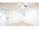 Well-lit bedroom featuring plush carpeting, a ceiling fan, and a bright window at 3204 Manor Ridge Dr, Raleigh, NC 27603