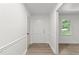 Bright foyer with white walls, wood-look floors, and white trim and doors at 3204 Manor Ridge Dr, Raleigh, NC 27603