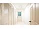 Hallway with tiled floor and multiple closet doors at 3204 Manor Ridge Dr, Raleigh, NC 27603