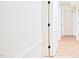 Bright hallway with white trim, neutral walls, and light wood floors at 3204 Manor Ridge Dr, Raleigh, NC 27603