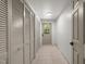 Hallway featuring tiled flooring, access to closets and natural lighting at 3204 Manor Ridge Dr, Raleigh, NC 27603