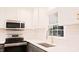 Kitchen features stainless steel appliances, stylish hardware, and quartz countertops at 3204 Manor Ridge Dr, Raleigh, NC 27603