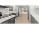 Modern kitchen features stainless steel appliances, white countertops, and stylish gray cabinets at 3204 Manor Ridge Dr, Raleigh, NC 27603