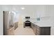 Modern kitchen with stainless steel appliances, white cabinets, subway tile backsplash, and white countertops at 3204 Manor Ridge Dr, Raleigh, NC 27603