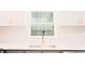 Kitchen sink features modern faucet, quartz countertops, and tiled backsplash at 3204 Manor Ridge Dr, Raleigh, NC 27603