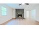 Spacious living room with a fireplace, ceiling fan and wood floors at 3204 Manor Ridge Dr, Raleigh, NC 27603