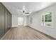 Bright living room featuring hardwood floors, white walls, and modern paneling at 3204 Manor Ridge Dr, Raleigh, NC 27603