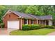 Brick home with a two-car garage and well-maintained landscaping at 3204 Manor Ridge Dr, Raleigh, NC 27603