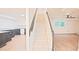 Finished basement with kitchenette, staircase and wood-look flooring at 3204 Manor Ridge Dr, Raleigh, NC 27603