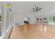 Spacious sunroom with vaulted ceilings, large windows, and access to outdoor deck at 3204 Manor Ridge Dr, Raleigh, NC 27603