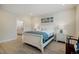 Bright bedroom featuring a white bed frame, light wood flooring, and en-suite bathroom at 328 Boone St, Chapel Hill, NC 27516