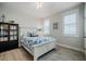 Bright bedroom featuring light grey flooring and a bookcase at 328 Boone St, Chapel Hill, NC 27516