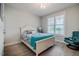 Comfortable bedroom featuring a queen-sized bed, chair, and large window allowing plenty of natural light at 328 Boone St, Chapel Hill, NC 27516