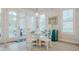 Cozy dining area with white furniture, bright natural light, and stylish decor, perfect for intimate meals and gatherings at 328 Boone St, Chapel Hill, NC 27516