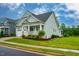 Charming home with a covered front porch, manicured lawn, and an attached two-car garage at 328 Boone St, Chapel Hill, NC 27516