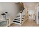 Inviting foyer with a staircase, light hardwood floors, and views into the living areas at 328 Boone St, Chapel Hill, NC 27516
