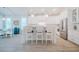 Bright and airy kitchen with white cabinetry, stainless steel appliances, and an island with bar seating, perfect for gathering at 328 Boone St, Chapel Hill, NC 27516