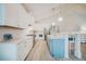 A spacious and modern kitchen showcasing an island with seating and stainless steel appliances for the home cook at 328 Boone St, Chapel Hill, NC 27516