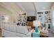 Cozy living room with white accents and built in shelves displaying decor and a sofa with throw pillows at 328 Boone St, Chapel Hill, NC 27516