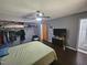 Neutral bedroom with hardwood floors, ceiling fan and closet space at 3612 Satellite Ct, Raleigh, NC 27604