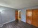 Cozy bedroom featuring wood-look flooring and large closets at 3612 Satellite Ct, Raleigh, NC 27604