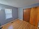 Bright bedroom featuring hardwood flooring and a spacious closet at 3612 Satellite Ct, Raleigh, NC 27604