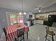 Bright kitchen and dining area with white cabinets, granite countertops and backyard access at 3612 Satellite Ct, Raleigh, NC 27604