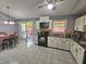Bright eat-in kitchen featuring tile flooring, countertops, and stainless steel appliances at 3612 Satellite Ct, Raleigh, NC 27604