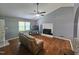 Cozy living room with hardwood floors, fireplace, and neutral gray walls at 3612 Satellite Ct, Raleigh, NC 27604