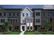 Charming townhome with gray and brick exterior, neat lawn, and welcoming entrance at 368 Chesapeak Commons St # 132, Garner, NC 27529